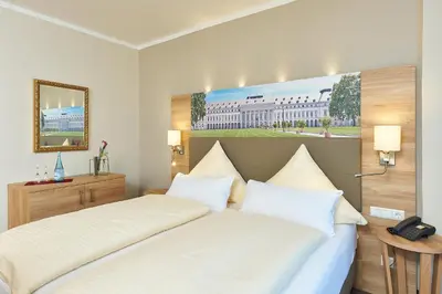 Ein Bett oder Betten in einem Zimmer der Unterkunft Hotel Morjan