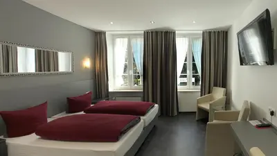 Ein Bett oder Betten in einem Zimmer der Unterkunft Hotel Zur Post
