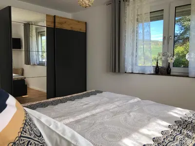 Ein Bett oder Betten in einem Zimmer der Unterkunft Ferienwohnung Kleine Auszeit