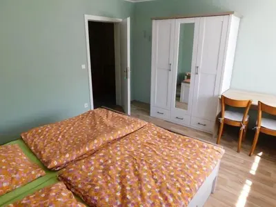 Ein Bett oder Betten in einem Zimmer der Unterkunft FeWo Kailbachtal