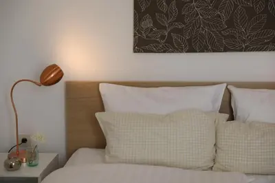 Ein Bett oder Betten in einem Zimmer der Unterkunft Hotel Weinlaube