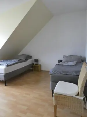 Ein Bett oder Betten in einem Zimmer der Unterkunft Ferienwohnung im Herzen Neuwied - Heddesdorf