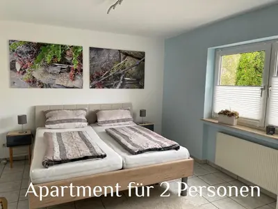 Ein Bett oder Betten in einem Zimmer der Unterkunft Ferienwohnung Zenzen