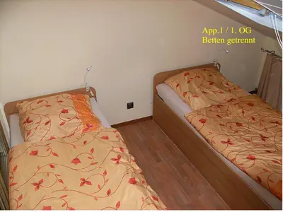 Ein Bett oder Betten in einem Zimmer der Unterkunft Järgen Ferienappartements
