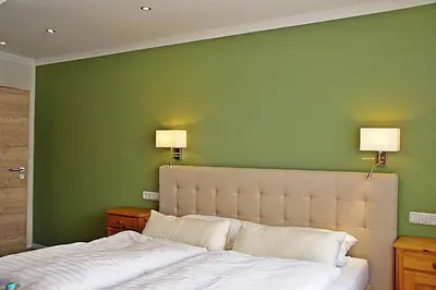 Ein Bett oder Betten in einem Zimmer der Unterkunft Hotel Eifelstube