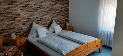 Ein Bett oder Betten in einem Zimmer der Unterkunft Gästezimmer Elly Dostert