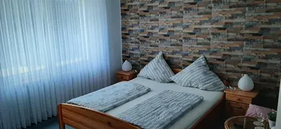 Ein Bett oder Betten in einem Zimmer der Unterkunft Gästezimmer Elly Dostert