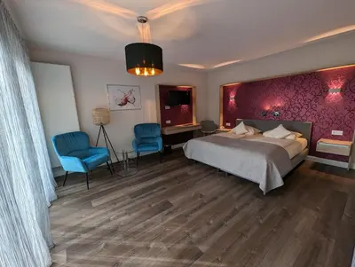 Ein Bett oder Betten in einem Zimmer der Unterkunft Weinhotel St. Stephanus