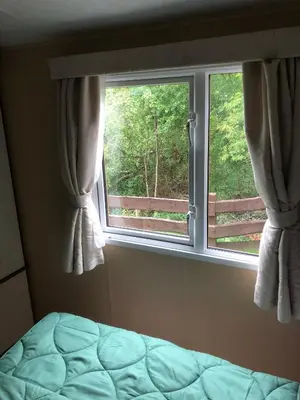 Ein Bett oder Betten in einem Zimmer der Unterkunft Ferienhaus Chilllout Chalets Daun-Kradenbach