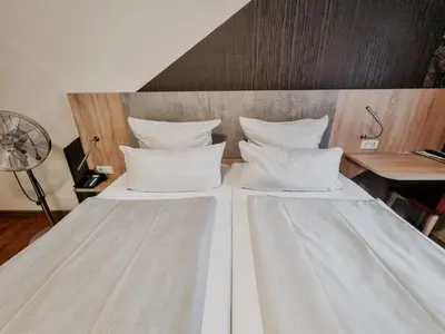 Ein Bett oder Betten in einem Zimmer der Unterkunft Hotel Estricher Hof