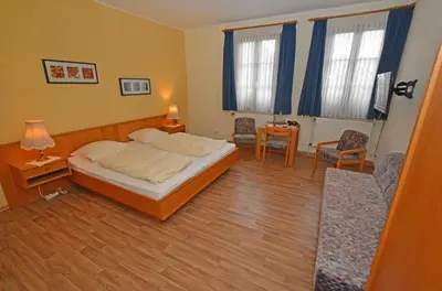 Ein Bett oder Betten in einem Zimmer der Unterkunft Weinhaus Hehner-Kiltz