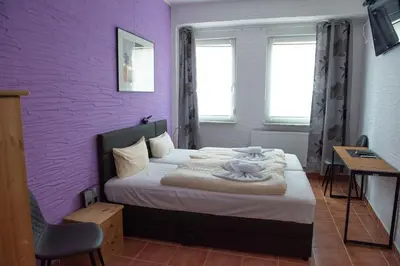 Ein Bett oder Betten in einem Zimmer der Unterkunft Neubert`s Gasthaus am Rhein