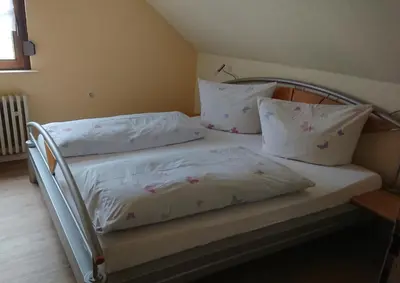 Ein Bett oder Betten in einem Zimmer der Unterkunft Weingut Bollig-Prüm