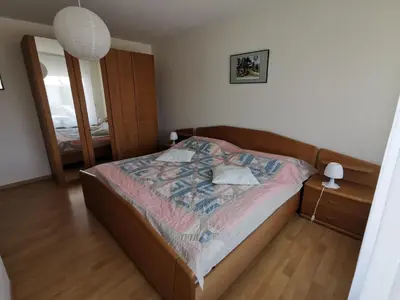Ein Bett oder Betten in einem Zimmer der Unterkunft Ferienwohnung zum Bätstän
