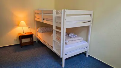Ein Bett oder Betten in einem Zimmer der Unterkunft Eifeler Hof - Ihr Restaurant für Genussmomente in Kyllburg