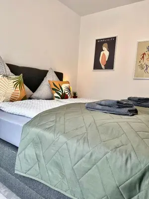 Ein Bett oder Betten in einem Zimmer der Unterkunft Ferienwohnung Bloom