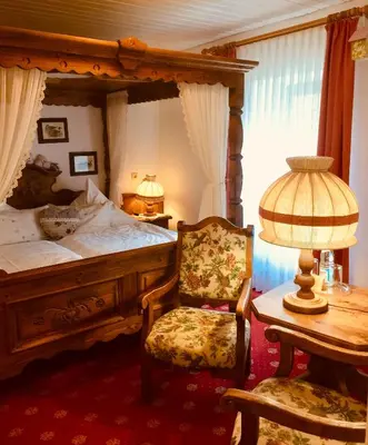 Ein Bett oder Betten in einem Zimmer der Unterkunft Landhotel am Wenzelbach