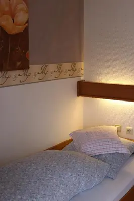Ein Bett oder Betten in einem Zimmer der Unterkunft Hotel Restaurant Bürgerstube