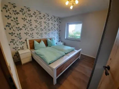 Ein Bett oder Betten in einem Zimmer der Unterkunft Ferienwohnung Karussell