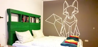 Ein Bett oder Betten in einem Zimmer der Unterkunft Die Schlummerkiste
