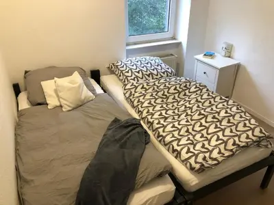 Ein Bett oder Betten in einem Zimmer der Unterkunft Ferienwohnung Zur alten Schmiede