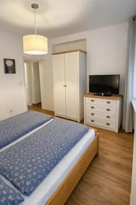 Ein Bett oder Betten in einem Zimmer der Unterkunft Haus Ambros