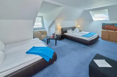 Ein Bett oder Betten in einem Zimmer der Unterkunft Park-Hotel Traben-Trarbach