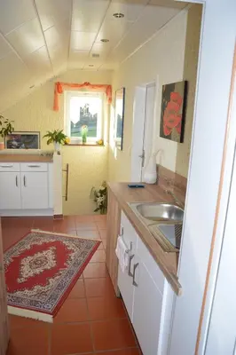 Küche/Küchenzeile in der Unterkunft Ferienwohnung Auszeit Waxweiler