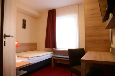 Ein Bett oder Betten in einem Zimmer der Unterkunft Weinhaus Gräfen