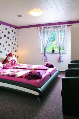 Ein Bett oder Betten in einem Zimmer der Unterkunft Hotel im Rheintal