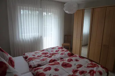 Ein Bett oder Betten in einem Zimmer der Unterkunft Ferienwohnung Haus Handwerk
