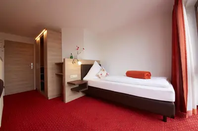 Ein Bett oder Betten in einem Zimmer der Unterkunft Hotel Schoos