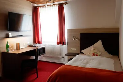 Ein Bett oder Betten in einem Zimmer der Unterkunft Hotel Schoos