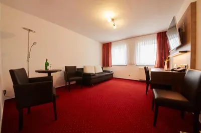 Ein Sitzbereich in der Unterkunft Hotel Schoos