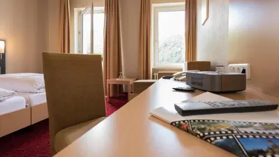 Ein Bett oder Betten in einem Zimmer der Unterkunft Rheinhotel Lamm