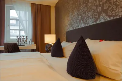 Ein Bett oder Betten in einem Zimmer der Unterkunft Landhotel Zum Kronprinzen