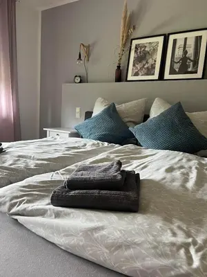Ein Bett oder Betten in einem Zimmer der Unterkunft Moderne familienfreundliche Wohnung am Waldrand von Prüm mit Terrasse