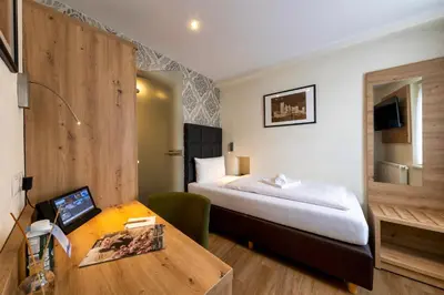 Ein Bett oder Betten in einem Zimmer der Unterkunft AKZENT Hotel Restaurant Roter Ochse Rhens bei Koblenz