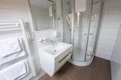Ein Badezimmer in der Unterkunft Hotel Sewenig