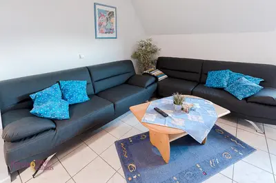 Ein Sitzbereich in der Unterkunft Ferienwohnung Hörning