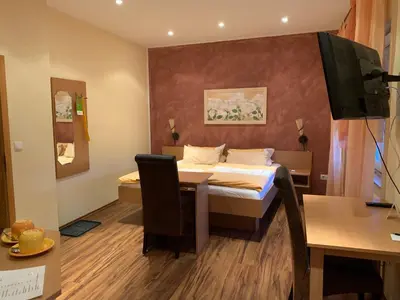 Ein Bett oder Betten in einem Zimmer der Unterkunft Hotel Sonnenhof