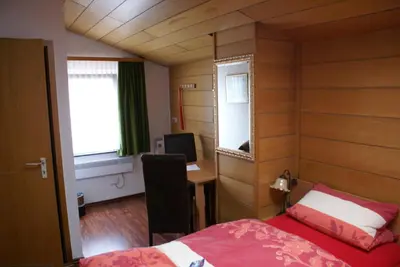 Ein Bett oder Betten in einem Zimmer der Unterkunft Hotel Sonnenhof