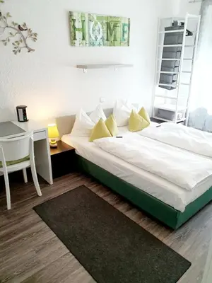 Ein Bett oder Betten in einem Zimmer der Unterkunft Hotel Deutschherrenhof