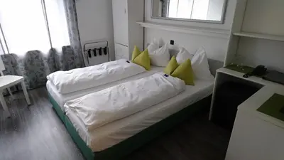 Ein Bett oder Betten in einem Zimmer der Unterkunft Hotel Deutschherrenhof