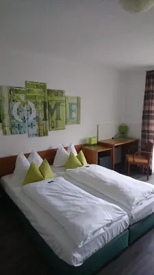 Ein Bett oder Betten in einem Zimmer der Unterkunft Hotel Deutschherrenhof