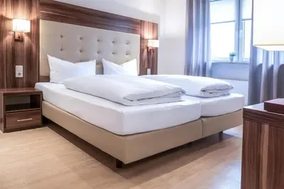 Ein Bett oder Betten in einem Zimmer der Unterkunft Hotel Ehranger Hof