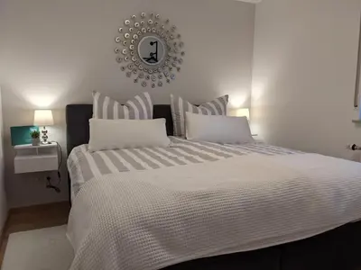 Ein Bett oder Betten in einem Zimmer der Unterkunft Ferienwohnung Am Waldweg