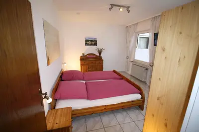 Ein Bett oder Betten in einem Zimmer der Unterkunft Komfort Ferienwohnung FEWO74-2