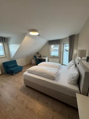 Ein Bett oder Betten in einem Zimmer der Unterkunft Hotel Heimatherz