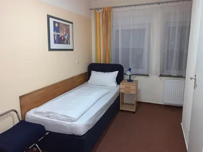 Ein Bett oder Betten in einem Zimmer der Unterkunft Hotel National
